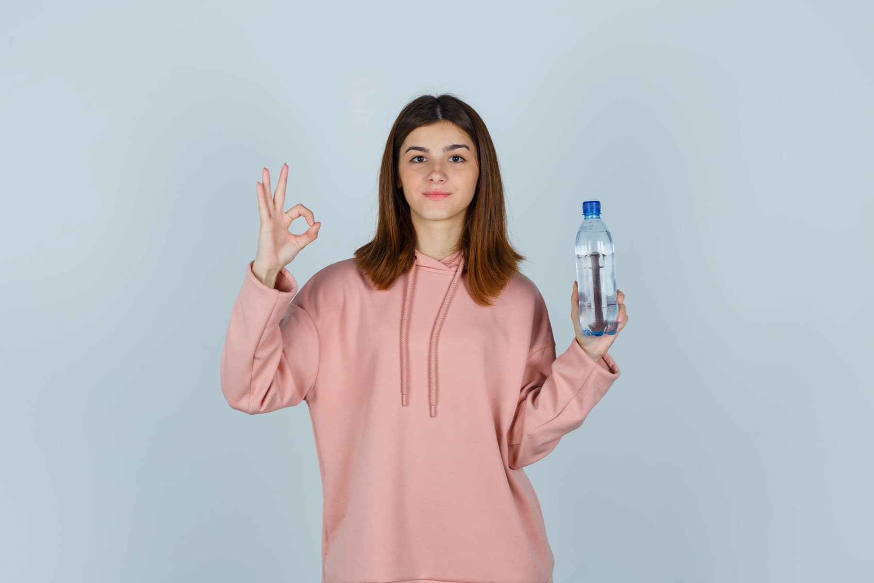 Student carrying a bottle of drinking water